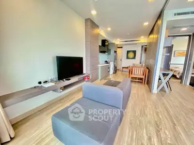 Spacious modern living room with sleek furniture and open layout in a stylish apartment.