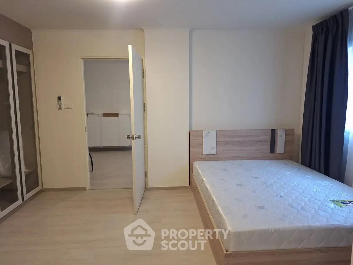 Spacious bedroom with modern design and ample natural light