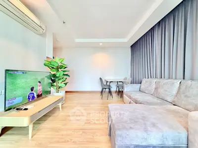 Spacious living room with modern decor and natural light