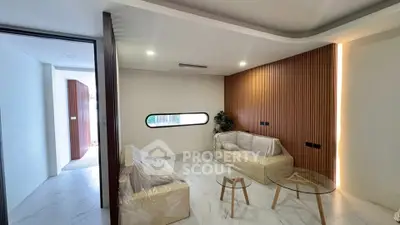 Modern living room with sleek design and wooden accent wall