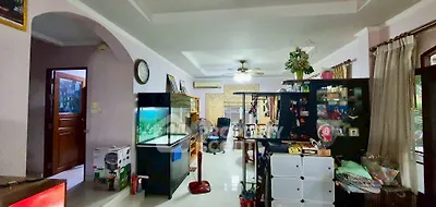 Spacious living room with aquarium and modern decor in a cozy home setting.