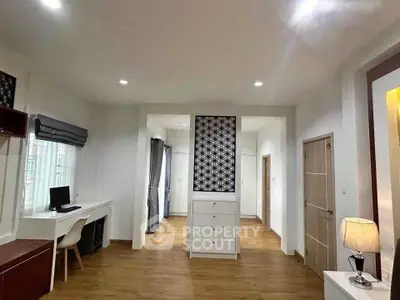 Spacious modern living room with elegant decor and ample natural light
