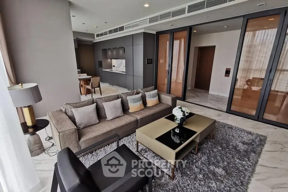 Luxurious modern living room with elegant decor and open kitchen layout