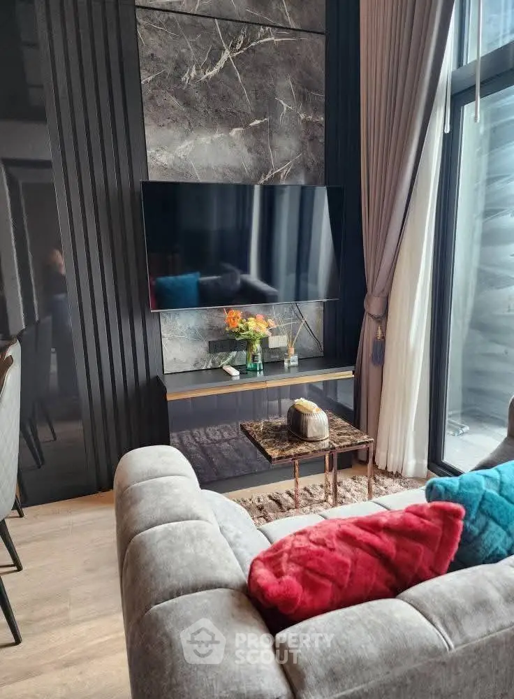 Luxurious modern living room with elegant decor and large window view