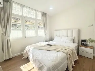Bright and cozy bedroom with natural light and modern decor