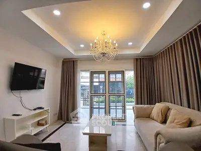 Elegant living room with chandelier and modern decor