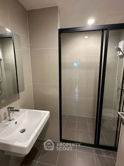 Modern bathroom with sleek design and glass shower enclosure