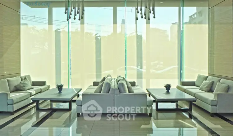 Luxurious modern living room with elegant sofas and large windows