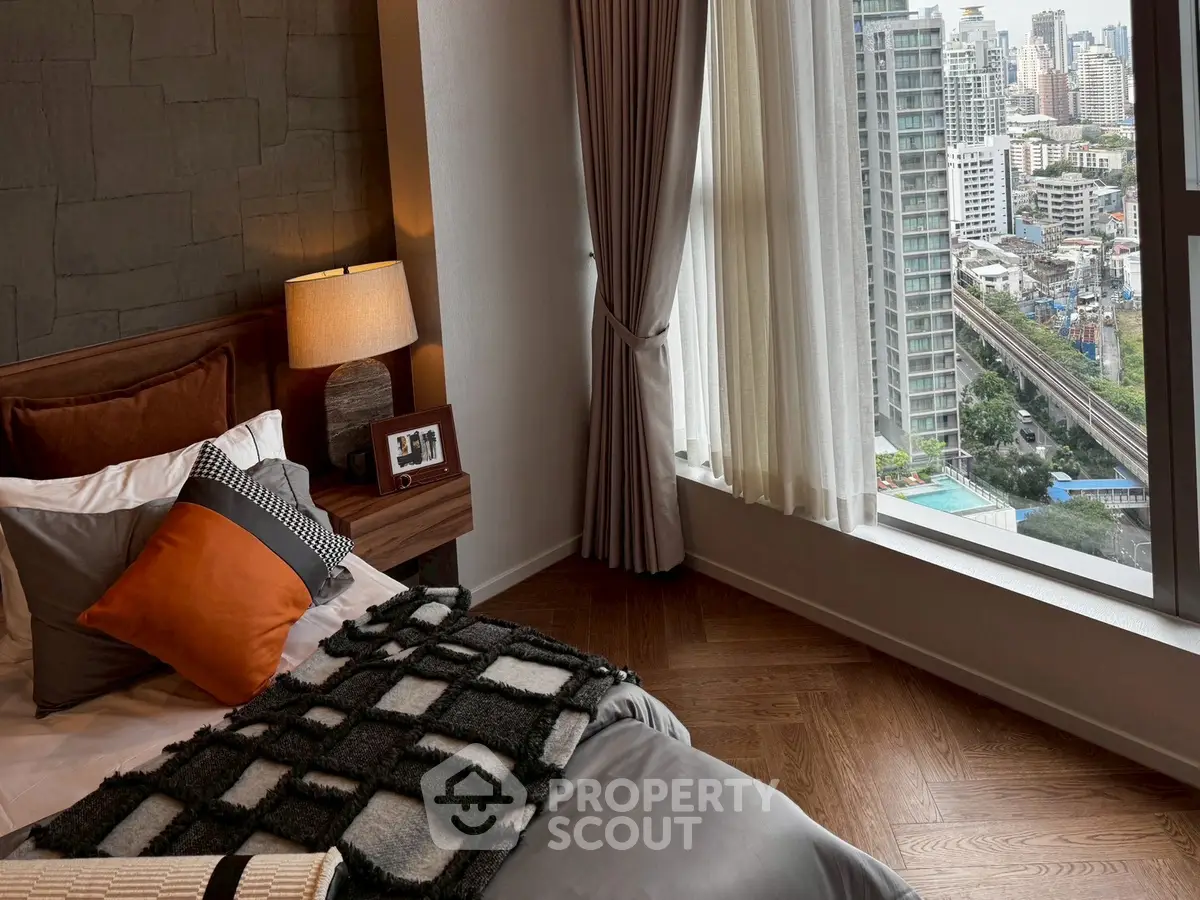 Luxurious bedroom with stunning city view and elegant decor