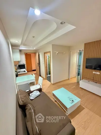 Modern living room with stylish ceiling design and cozy furniture