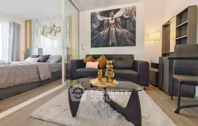 Stylish modern living room with elegant decor and cozy bedroom in open layout apartment.