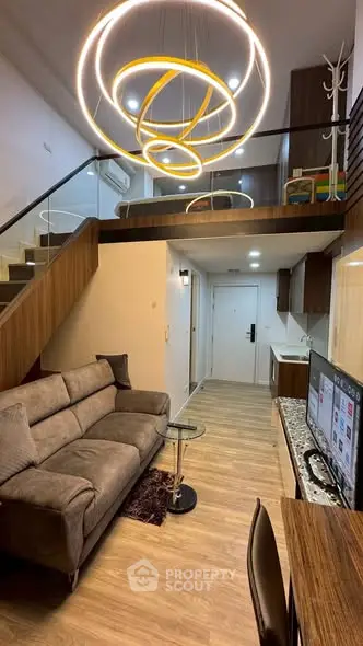 Modern duplex living room with stylish lighting and cozy seating area