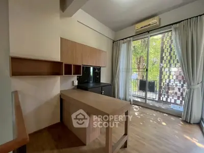 Modern kitchen with open layout and balcony view