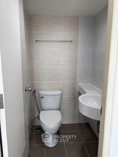 Modern bathroom with sleek fixtures and neutral tile design