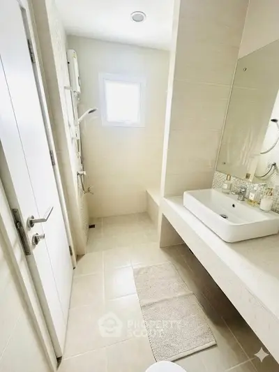 Bright and modern bathroom with sleek fixtures and natural light