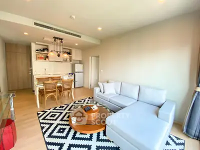 Spacious modern living room with open kitchen and stylish decor