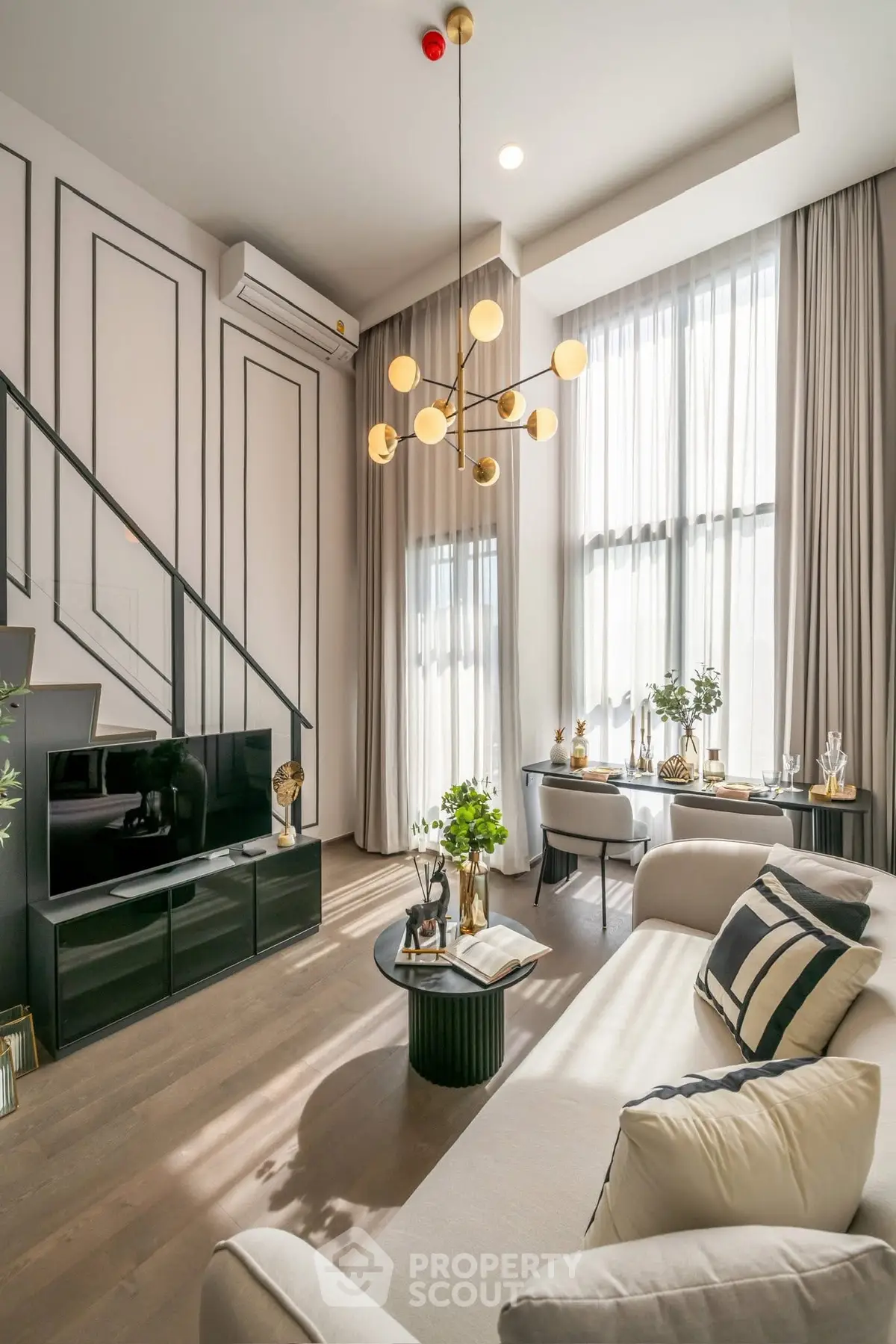 Luxurious modern living room with high ceilings and elegant decor