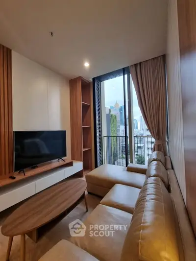 Modern living room with city view, featuring sleek furniture and floor-to-ceiling windows.