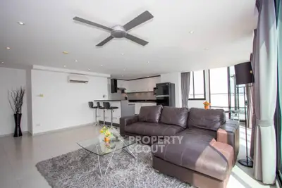 Spacious modern living room with open kitchen and stylish decor