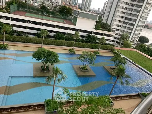 Stunning rooftop pool with lush greenery and cityscape views