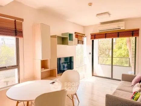 Bright modern living room with large windows and stylish furniture