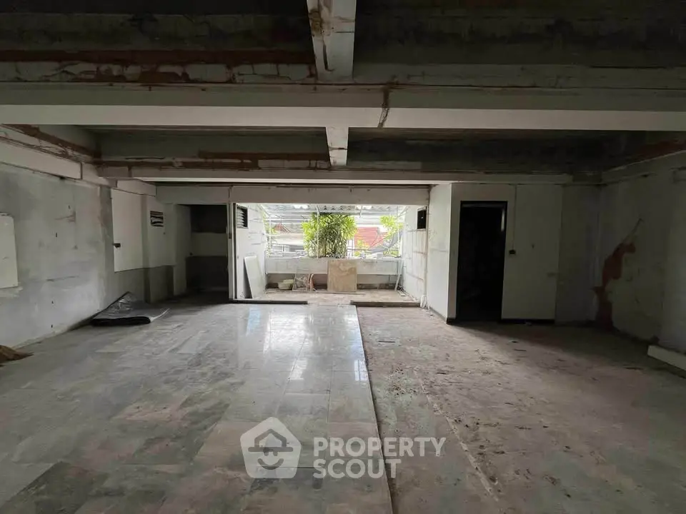 Spacious unfinished interior with potential for customization and renovation.