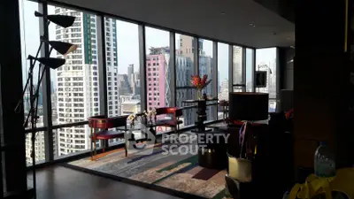 Luxurious high-rise living room with panoramic city views and elegant decor