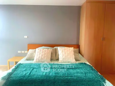 Cozy bedroom with modern decor and ample storage space