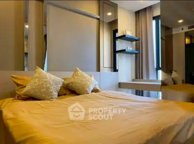 Modern bedroom with stylish decor and ample natural light