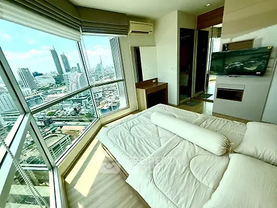 Luxurious bedroom with panoramic city view in modern high-rise apartment