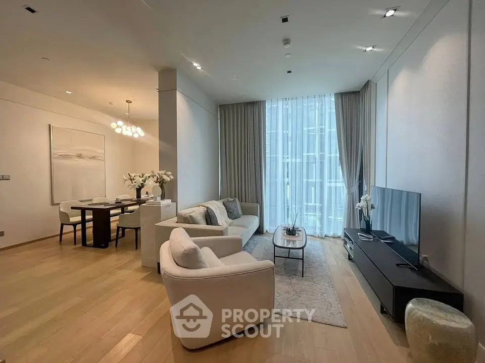 Luxurious modern living room with elegant dining area and floor-to-ceiling windows.