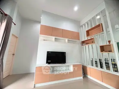 Modern living room with stylish built-in cabinets and sleek TV setup