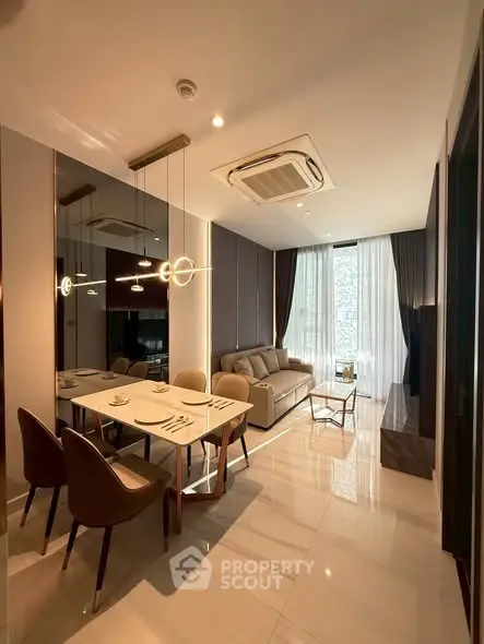 Modern living room with elegant dining area and stylish lighting in a luxury apartment.