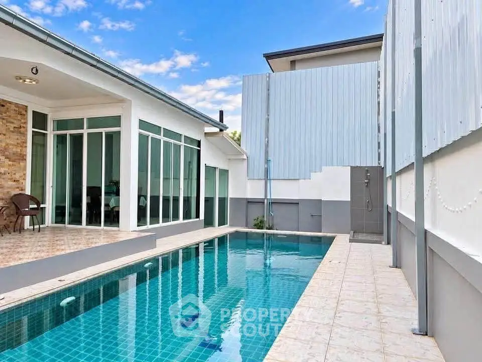 Modern home with private swimming pool and stylish exterior design.