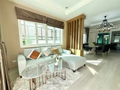 Elegant living room with modern decor and natural light