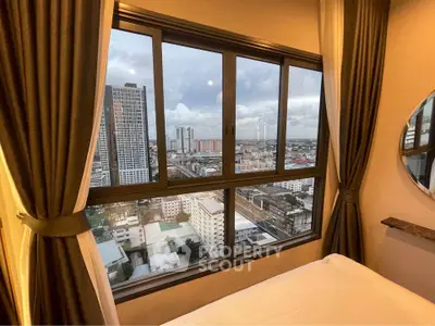 Stunning city view from a cozy bedroom window with elegant curtains and modern decor.