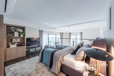 Luxurious modern bedroom with elegant decor and large windows offering stunning views.