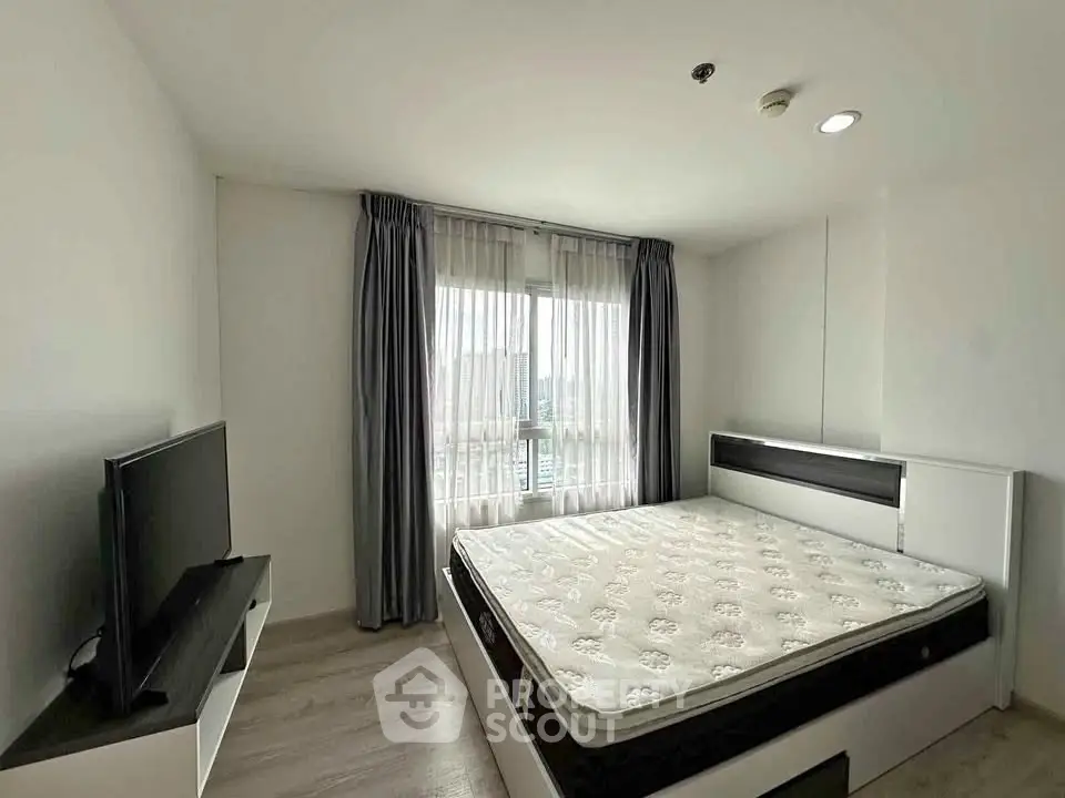 Modern bedroom with large window and minimalist decor