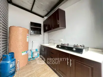 Spacious kitchen with gas stove and ample storage in modern home