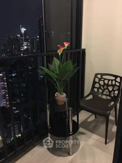 Chic urban balcony with city skyline view, stylish chair, and elegant potted plant for serene relaxation.