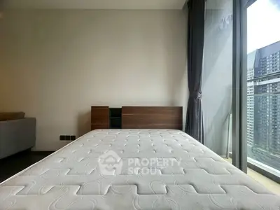 Modern bedroom with large window and city view, featuring a minimalist bed and stylish decor.