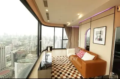 Luxurious corner unit living room with panoramic city view and stylish decor