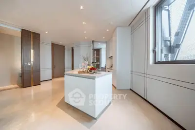Luxurious modern kitchen with sleek design and ample natural light