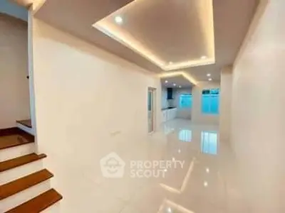 Spacious modern interior with sleek lighting and glossy floors, ideal for contemporary living.