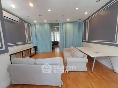 Spacious living room with elegant decor and ample natural light