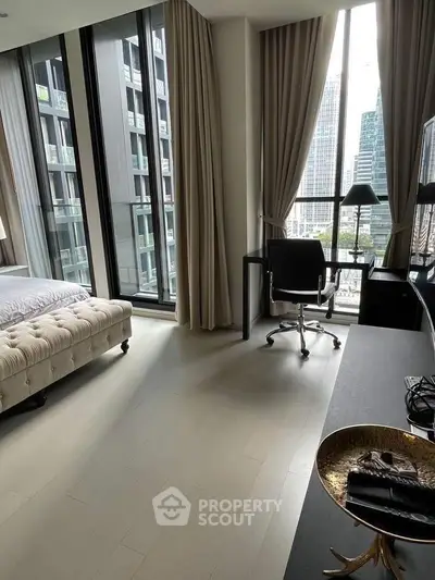 Luxurious bedroom with floor-to-ceiling windows and city view, featuring elegant decor and modern furnishings.