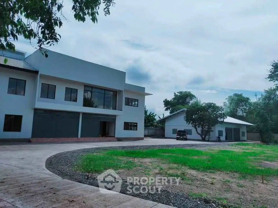 Spacious modern property with lush greenery and ample parking space