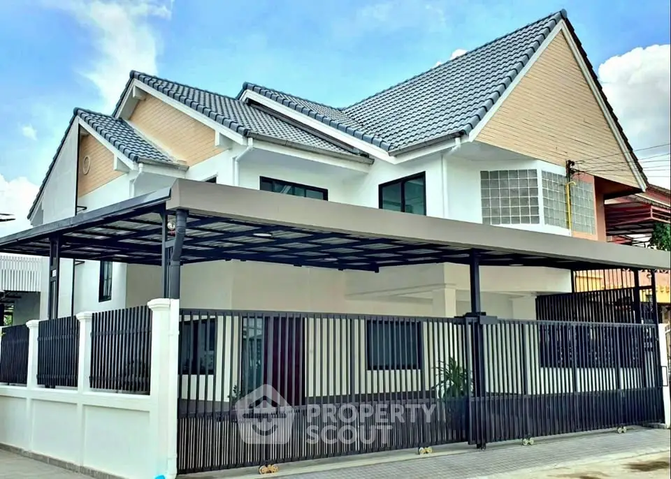 Modern two-story house with sleek design and spacious carport