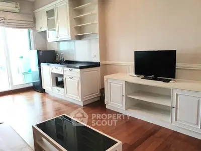 Charming living room with kitchenette and modern furnishings