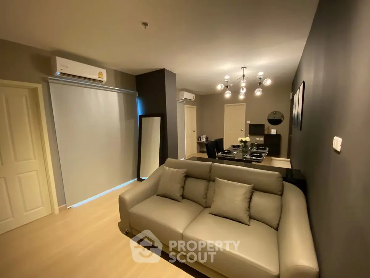 Modern living room with stylish decor and elegant lighting